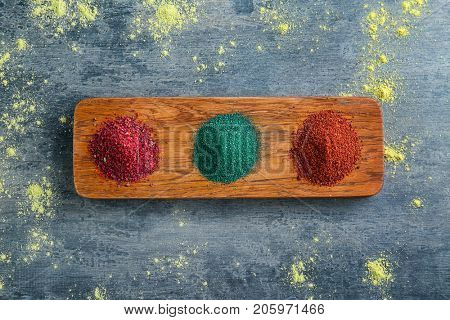 Various colorful superfood powders on color background