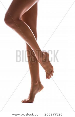 Woman Legs Silhouette On Studio Isolated White Background