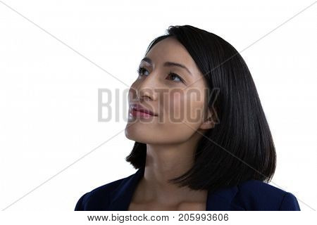 Close-up of thoughtful businesswoman against white background