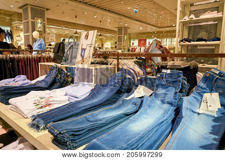 SAINT PETERSBURG, RUSSIA - CIRCA AUGUST, 2017: jeans on display at Stradivarius store at Galeria shopping center. Stradivarius is an international women and men clothing fashion brand