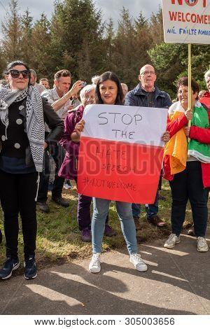 Shannon, Ireland, June. 5, 2019: A Lady Protesting Against The Donald Trump Visit With Signs At Shan