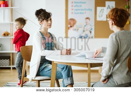 Adhd Child's Therapist Talk With Mother And Ask Questions During First Session