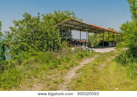 Large Metal Parking Shelter In Wilderness At Abandoned Public Fishing Village,.