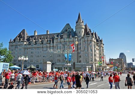 Ottawa, Canada - July 1, 2011: People In Front Of Fairmont Chateau Laurier Hotel On Canada Day In Do
