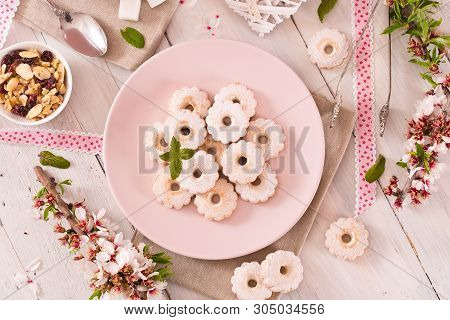 Canestrelli Biscuits With Icing Sugar On Wooden Table.