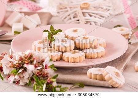 Canestrelli Biscuits With Icing Sugar On Wooden Table.