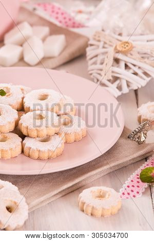 Canestrelli Biscuits With Icing Sugar On Wooden Table.
