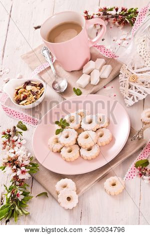 Canestrelli Biscuits With Icing Sugar On Wooden Table.
