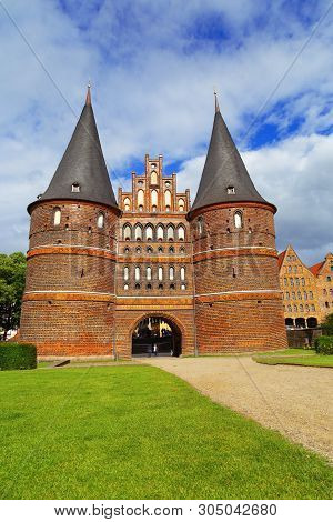 View On Holsten Gate Or Holstentor In German Town Lubeck.  Medieval Gate. Historical Monument. June 