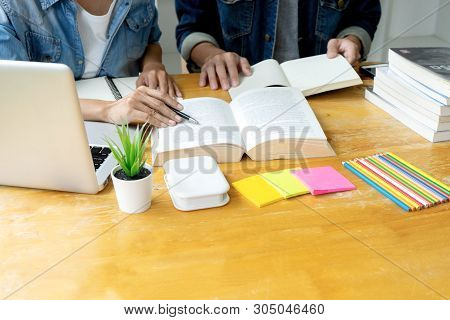 Woman And Man Work On The Table