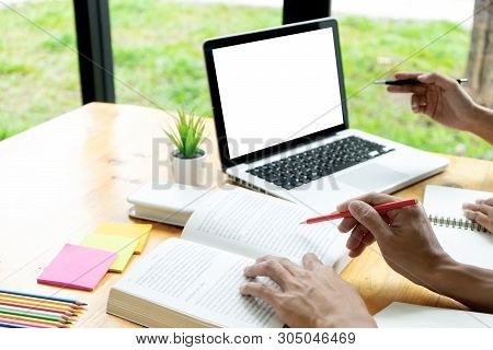 Woman And Man Work On The Table