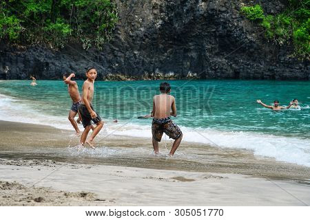 Bali, Indonesia - January 14, 2018: Kids Playing At Tropical Beach In Bali Near Chandidasa, Knowen A