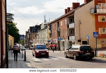Strangnas, Sweden - June 5, 2019: View Of The Storgatan Street With Traffic In The Downtown District