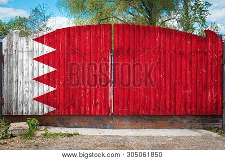 Close-up Of The National Flag Of Bahrein On A Wooden Gate At The Entrance To The Closed Territory On