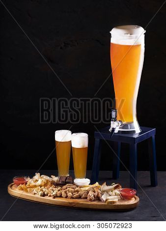 Beer Set For A Large Group Of Friends. Beer In Glasses Closeup On The Concrete Table. Beer And Snack
