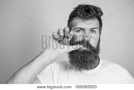 Fresh Juice Concept. Man Drinks Strawberry Juice Suck Thumb As Drink Straw Blue Background. Hipster 