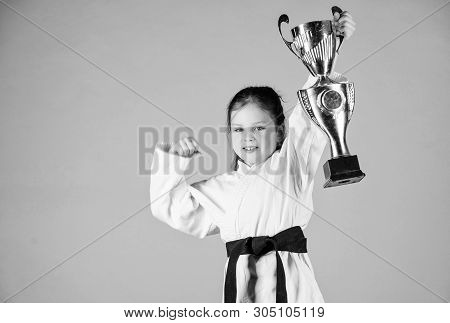 Sport Success In Single Combat. Practicing Kung Fu. Happy Childhood. Winner Little Girl In Gi Sports