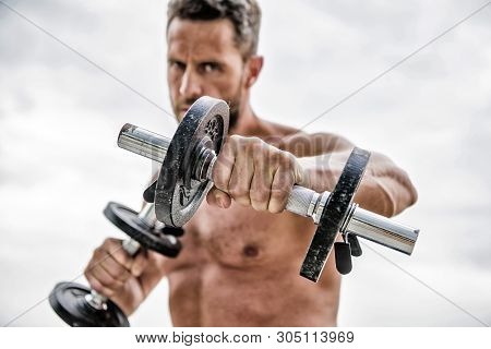 Man Sportsman Weightlifting. Athletic Body. Dumbbell Gym. Success. Perfect Biceps. Muscular Man Exer