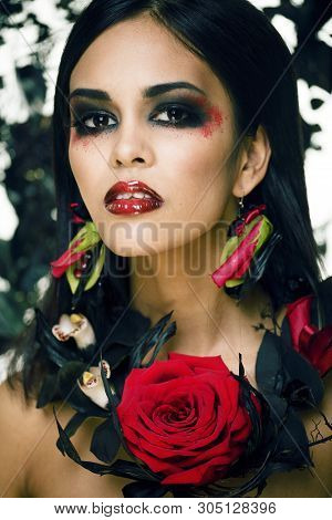 Pretty Brunette Woman With Rose Jewelry, Black And Red, Bright Make Up Kike A Vampire Closeup Red Li