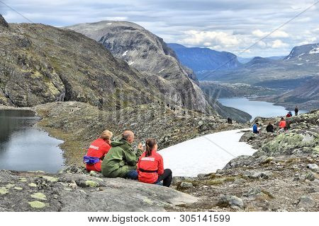 Jotunheimen, Norway - August 1, 2015: People Hike At Besseggen Trail In Jotunheimen National Park, N