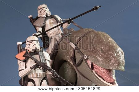 JUNE 1 2018: Recreation of a scene from Star Wars showing Sandtroopers and Dewback in the deserts of Tatooine, searching for the droids with the stolen Deathstar plans - Hasbro action figures