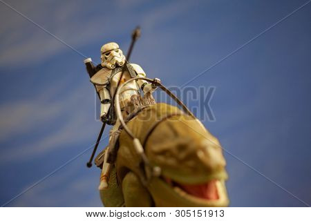 JUNE 1 2018: Recreation of a scene from Star Wars showing Sandtroopers and Dewback in the deserts of Tatooine, searching for the droids with the stolen Deathstar plans - Hasbro action figures