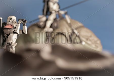JUNE 1 2018: Recreation of a scene from Star Wars showing Sandtroopers and Dewback in the deserts of Tatooine, searching for the droids with the stolen Deathstar plans - Hasbro action figures