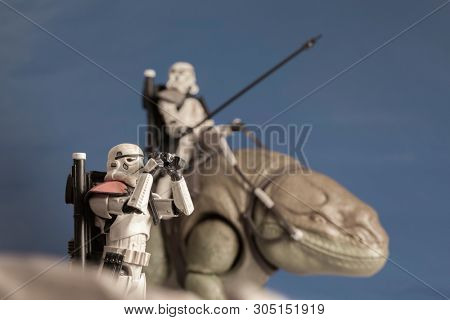 JUNE 1 2018: Recreation of a scene from Star Wars showing Sandtroopers and Dewback in the deserts of Tatooine, searching for the droids with the stolen Deathstar plans - Hasbro action figures