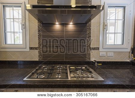 Interior Design Decor Showing Modern Kitchen Cooker Hob Appliance With Extractor Fan In Luxury Apart