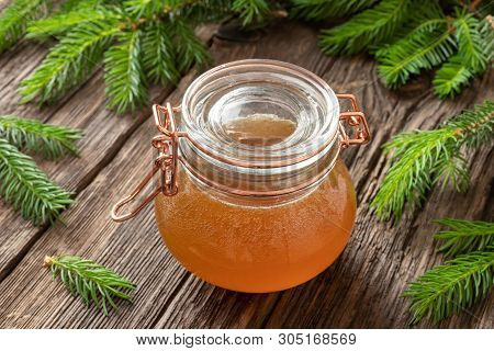 A Jar Of Homemade Herbal Syrup Against Cough Made From Young Spruce Tips