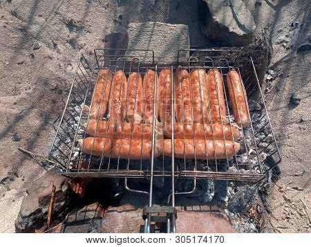 Kupaty Chicken Fried On A Fire. Barbecue From Kupaty.