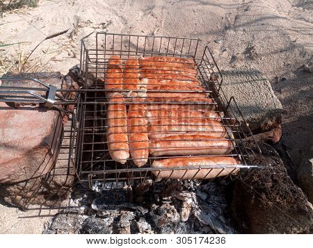 Kupaty Chicken Fried On A Fire. Barbecue From Kupaty.