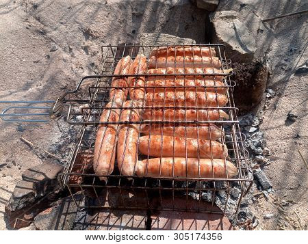 Kupaty Chicken Fried On A Fire. Barbecue From Kupaty.