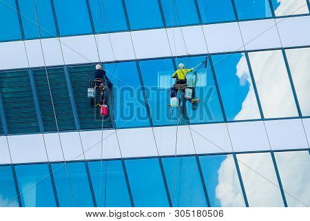 Moscow, Russia - May, 29, 2019: Steeplejacks Work on a Wall in Moscow 