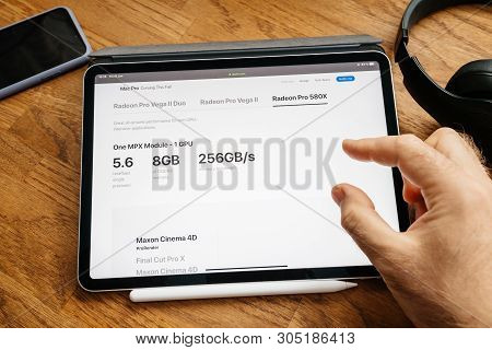 Paris, France - Jun 6, 2019: Man Reading On Apple Ipad Pro Tablet About Latest Announcement Of At De