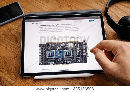 Paris, France - Jun 6, 2019: Man Reading On Apple Ipad Pro Tablet About Latest Announcement Of At De
