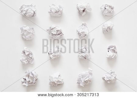 Waste Recycling. Flat Lay Of Crumpled Paper Ball Rows On White Surface. Abstract Background.