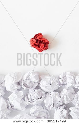Ideology Concept. Flat Lay Of Crumpled Same Color Paper Ball Pile Against Individual Red One. White 