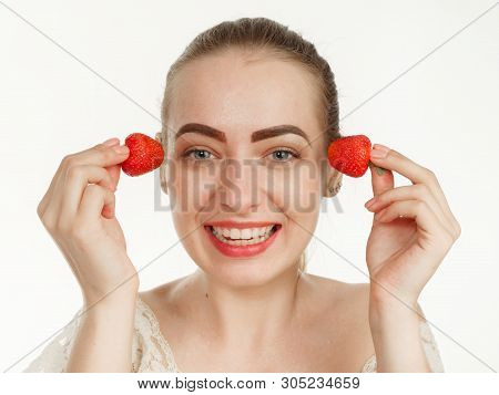 Beautiful Girl Makes Makeup Strawberry Berries On A White Background