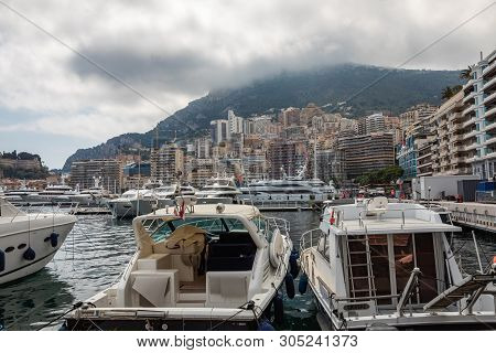 La Condamine, Monaco - June 04, 2019: Yachts Docked At Port Hercules In La Condamine Harbour. Citysc