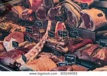 Munich, Germany - November 23, 2018 :counters And Showcases Of Butcher Shops At The Viktualienmarkt 