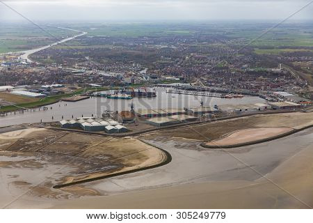 Aerial View Harbor Delfzijl With Wind Turbines And Factories In The Netherlands