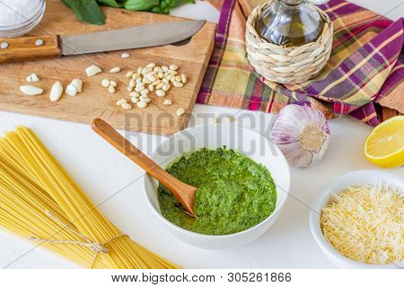 Pesto Sauce And Ingedients On A White Background. Italian Cuisine. Vegetarian Food. The Diet