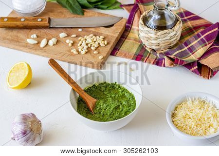 Pesto Sauce And Ingedients On A White Background. Italian Cuisine. Vegetarian Food. The Diet