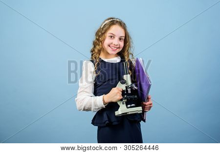 Science Research In Lab. Small Genius Girl With Microscope. Education And Knowledge. Back To School.