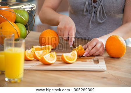 Cooking, Food And Concept Of Veganism, Vigor And Healthy Eating - Close Up Of Female Hand Cutting Or