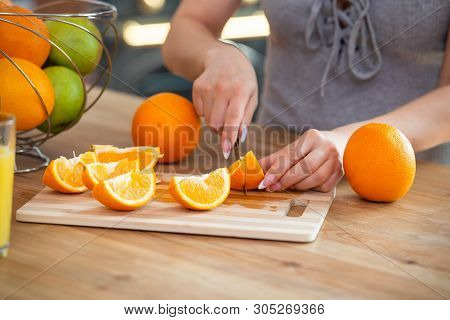 Cooking, Food And Concept Of Veganism, Vigor And Healthy Eating - Close Up Of Female Hand Cutting Or