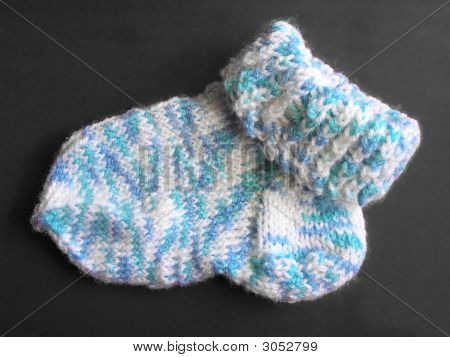 Gestrickte Socke auf grau
