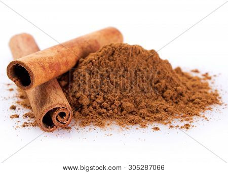 Cinnamon Sticks With Powder Isolated On White Background