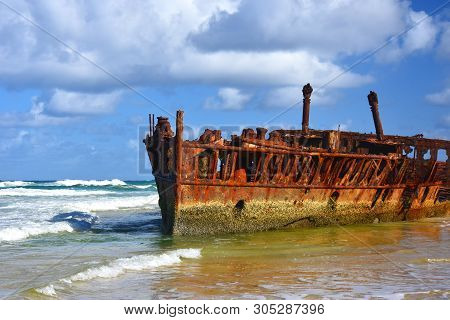 The Rusty Wreck Of The Vessel Maheno On The Shores Of Fraser Island (queensland, Australia). The Ant